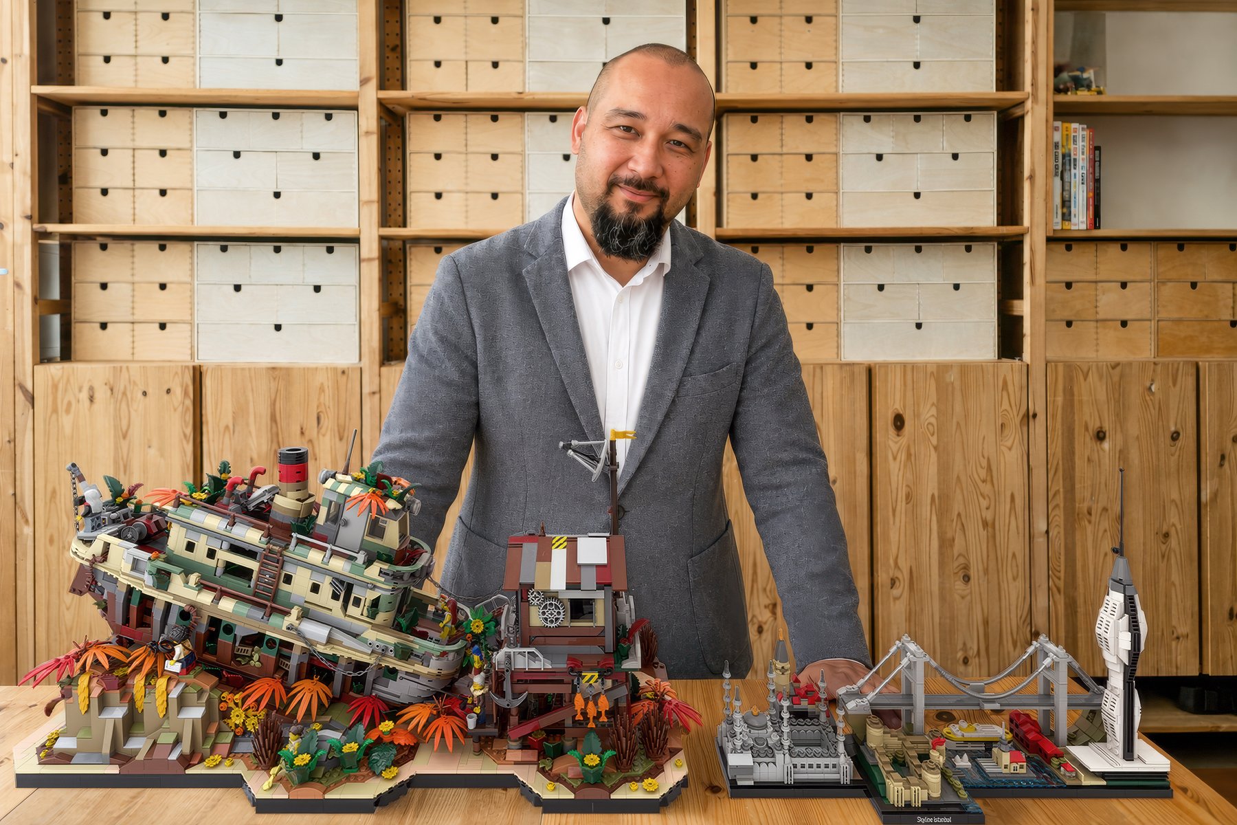 Ahmet N. Sati at the studio bench with The Iron Reef and Skyline Istanbul builds